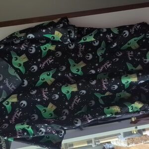 Women's Grogu scrub top.